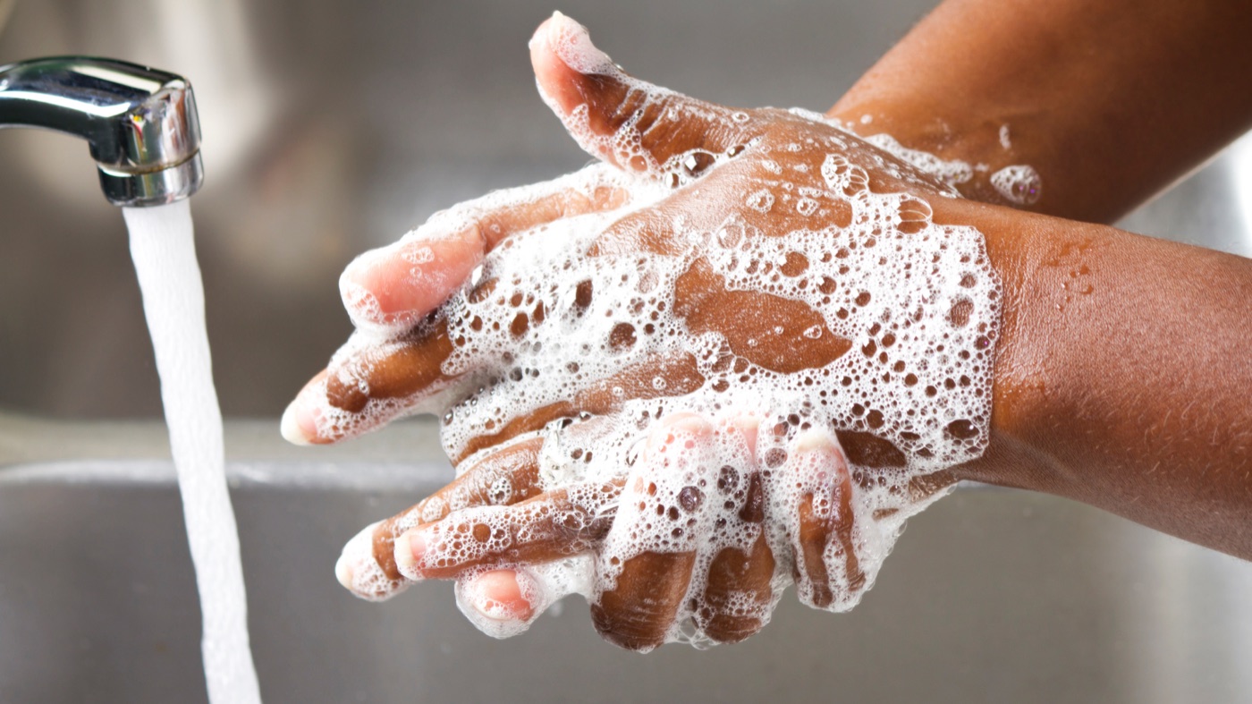 Hands washing dishes